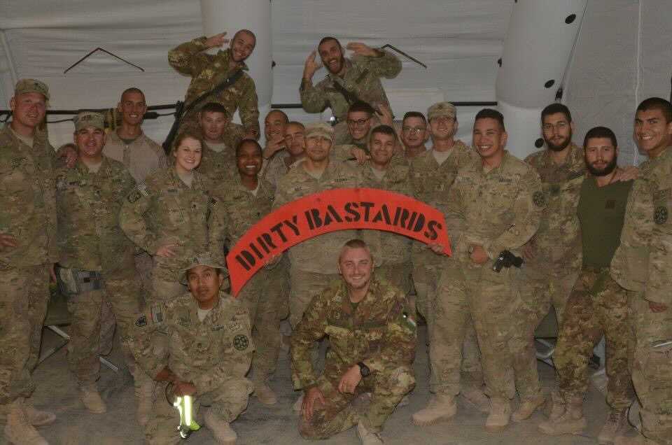 Happy Veteran's Day: Group of around 30 soldiers holding a "Dirty Bastards" sign.